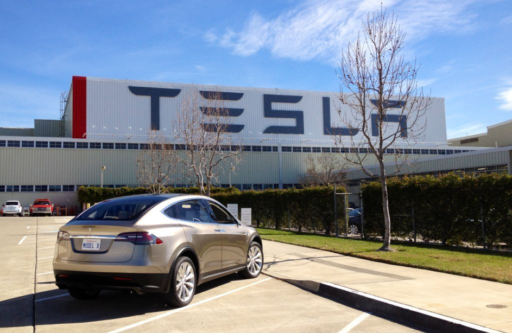 brand tesla in the front of the factory